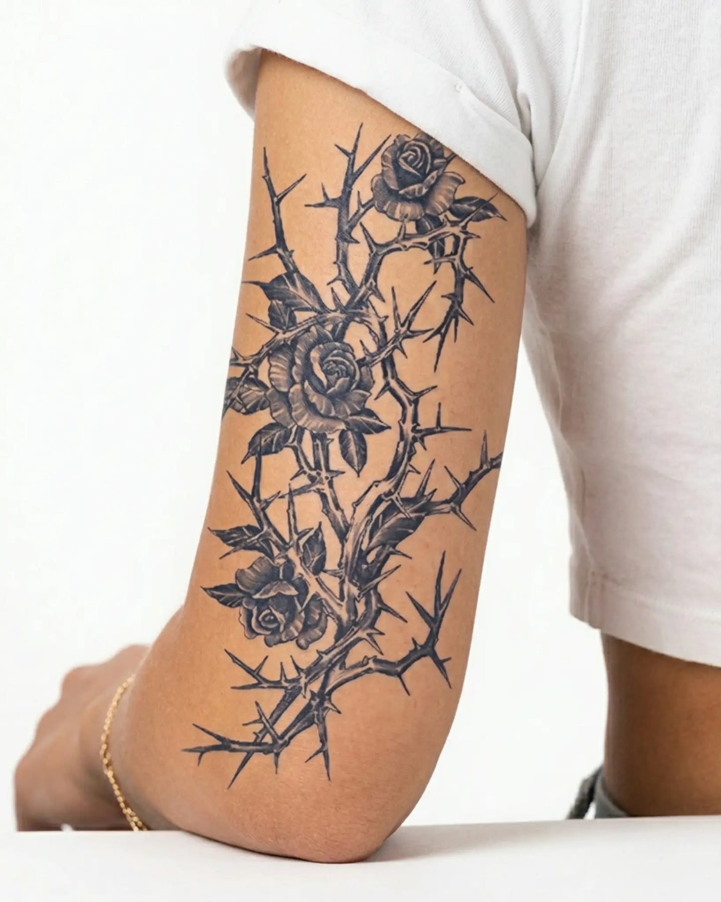 INKY Thorn Rose semi-permanent tattoo applied on a woman – 4 x 7 in (10x17 cm) design, realistic ink look, lasts 10 days