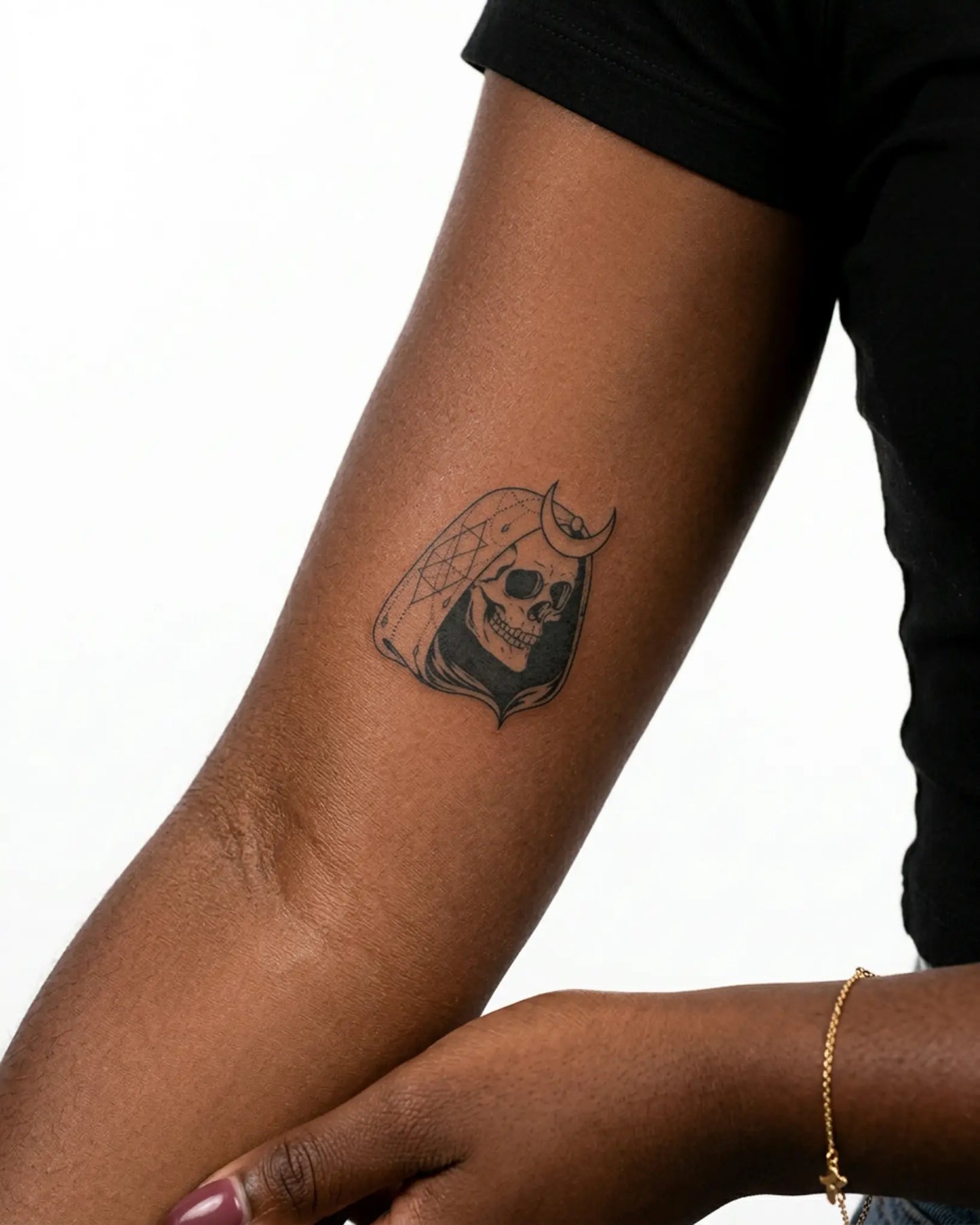 INKY Moon Reaper semi-permanent tattoo applied on a woman – 3 x 3 in (7x7 cm) design, realistic ink look, lasts 10 days