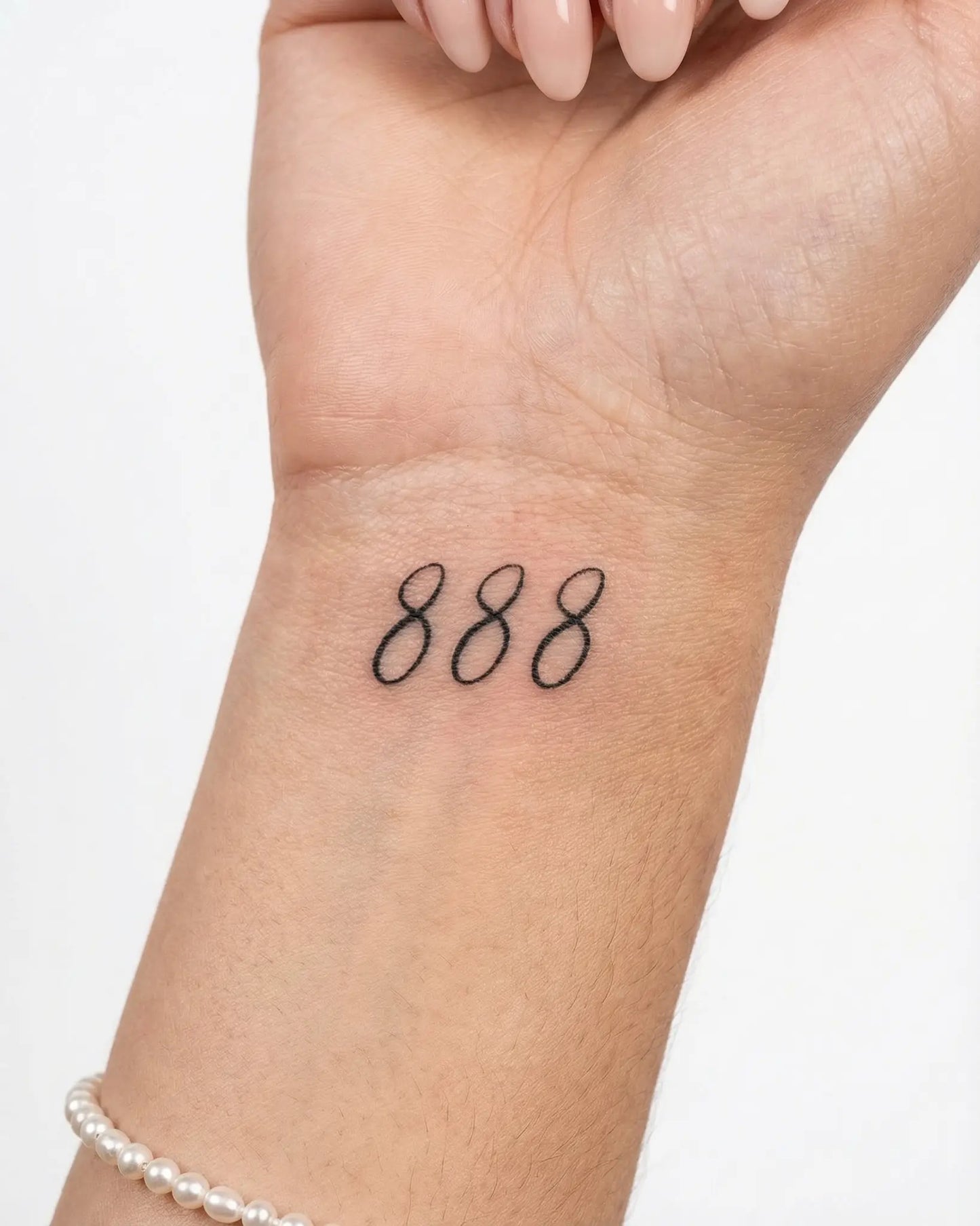INKY Lucky 888 semi-permanent tattoo applied on a woman – 2 x 2 in (4x4 cm) design, realistic ink look, lasts 10 days
