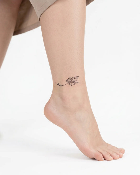 INKY Maple Swirl semi-permanent tattoo applied on a woman – 2 x 2 in (4x4 cm) design, realistic ink look, lasts 10 days