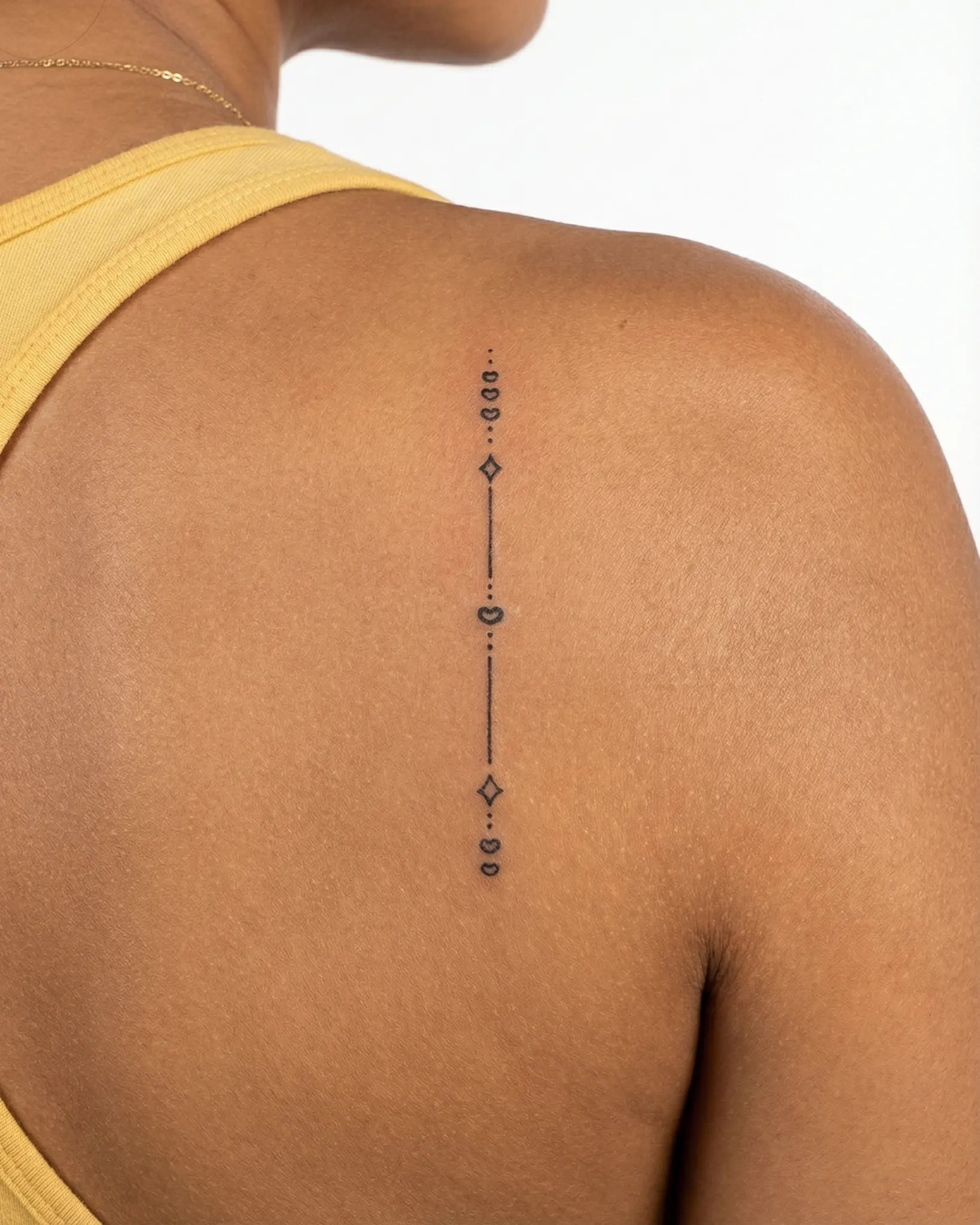 INKY Love Path semi-permanent tattoo applied on a woman – 2 x 4 in (6x10 cm) design, realistic ink look, lasts 10 days
