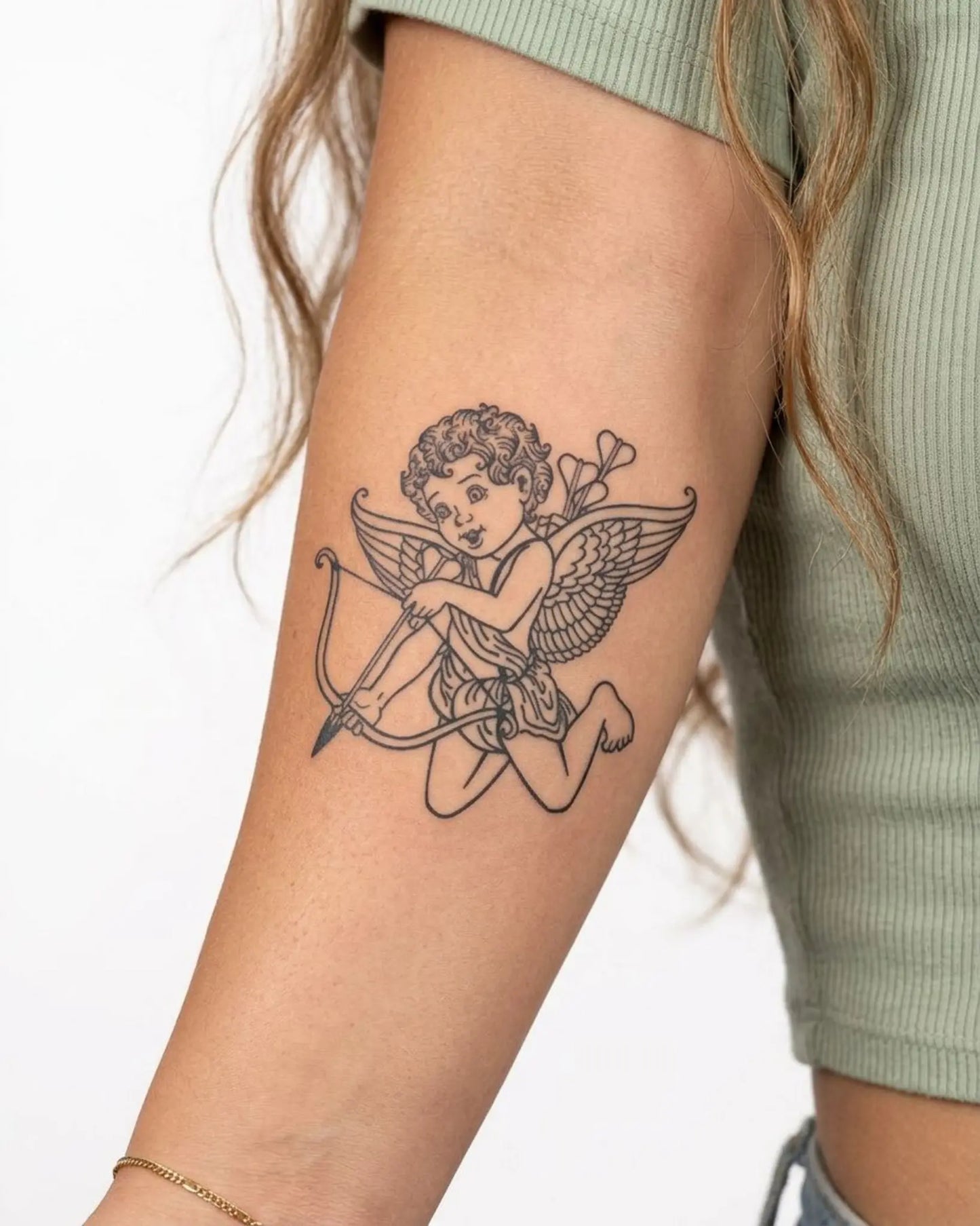 INKY Cupid Angel semi-permanent tattoo applied on a woman – 3 x 3 in (7x7 cm) design, realistic ink look, lasts 10 days