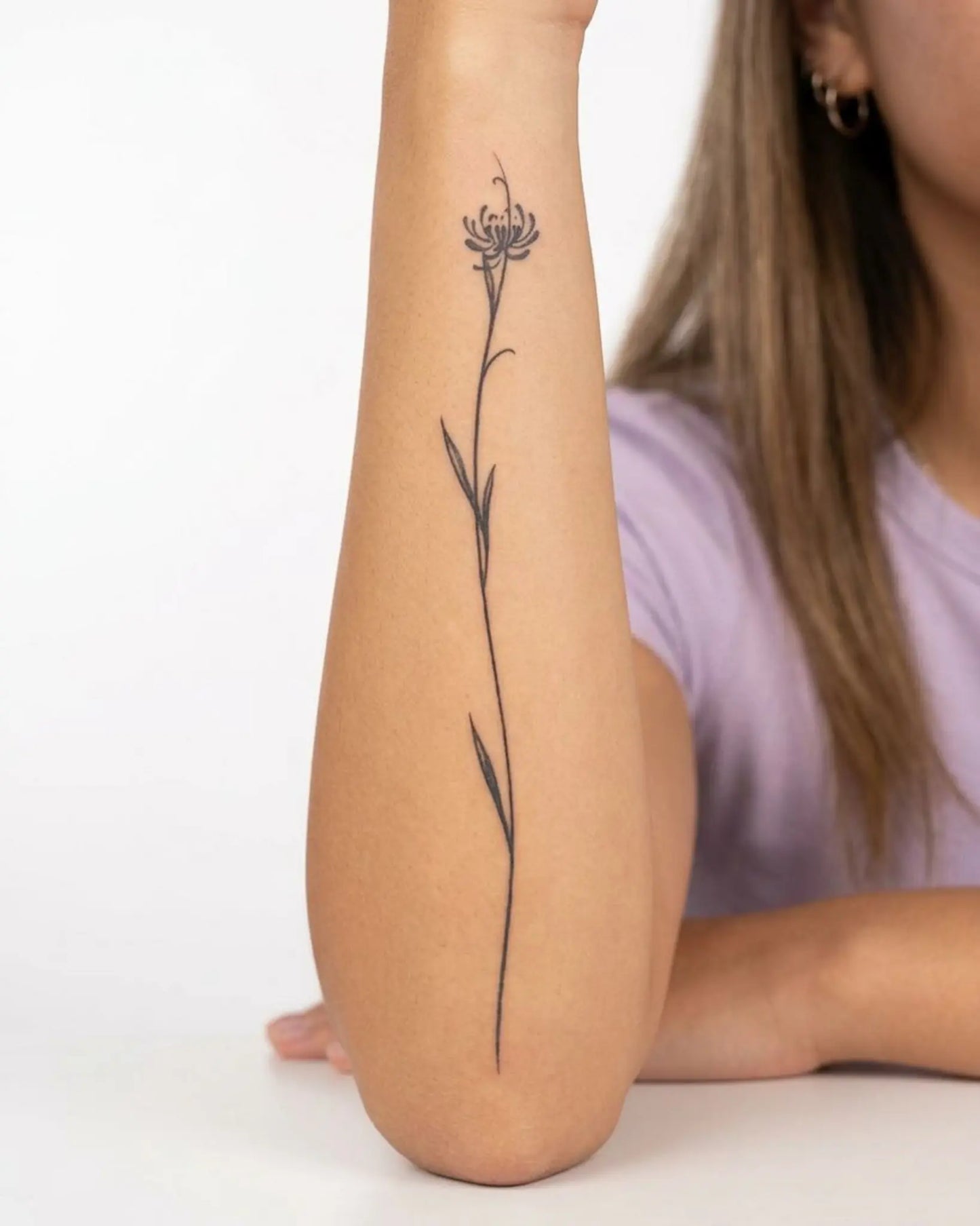 INKY Tall Bloom 2 semi-permanent tattoo applied on a woman – 4 x 7 in (10x17 cm) design, realistic ink look, lasts 10 days