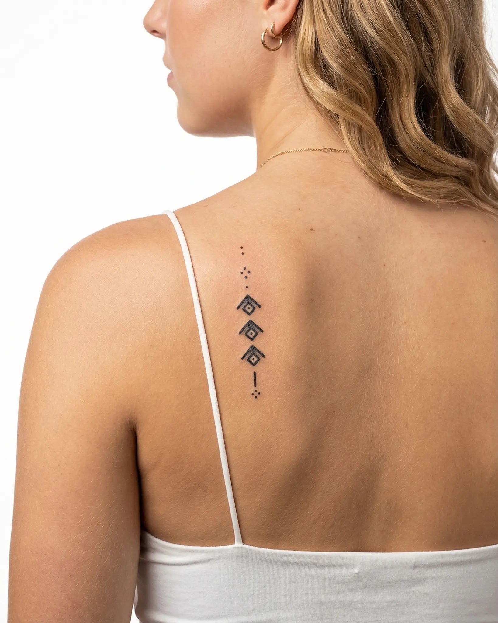 INKY Ascension semi-permanent tattoo applied on a woman – 2 x 4 in (6x10 cm) design, realistic ink look, lasts 10 days