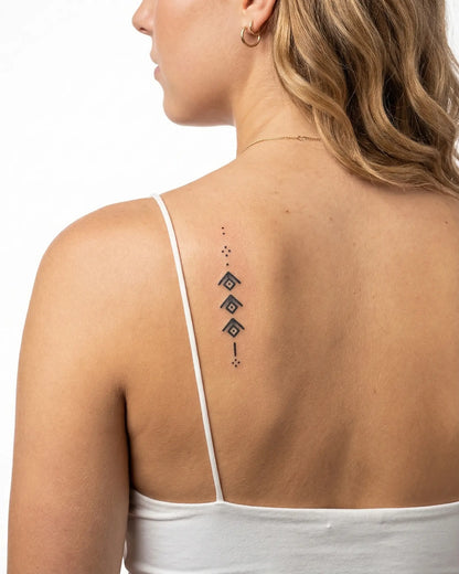 INKY Ascension semi-permanent tattoo applied on a woman – 2 x 4 in (6x10 cm) design, realistic ink look, lasts 10 days