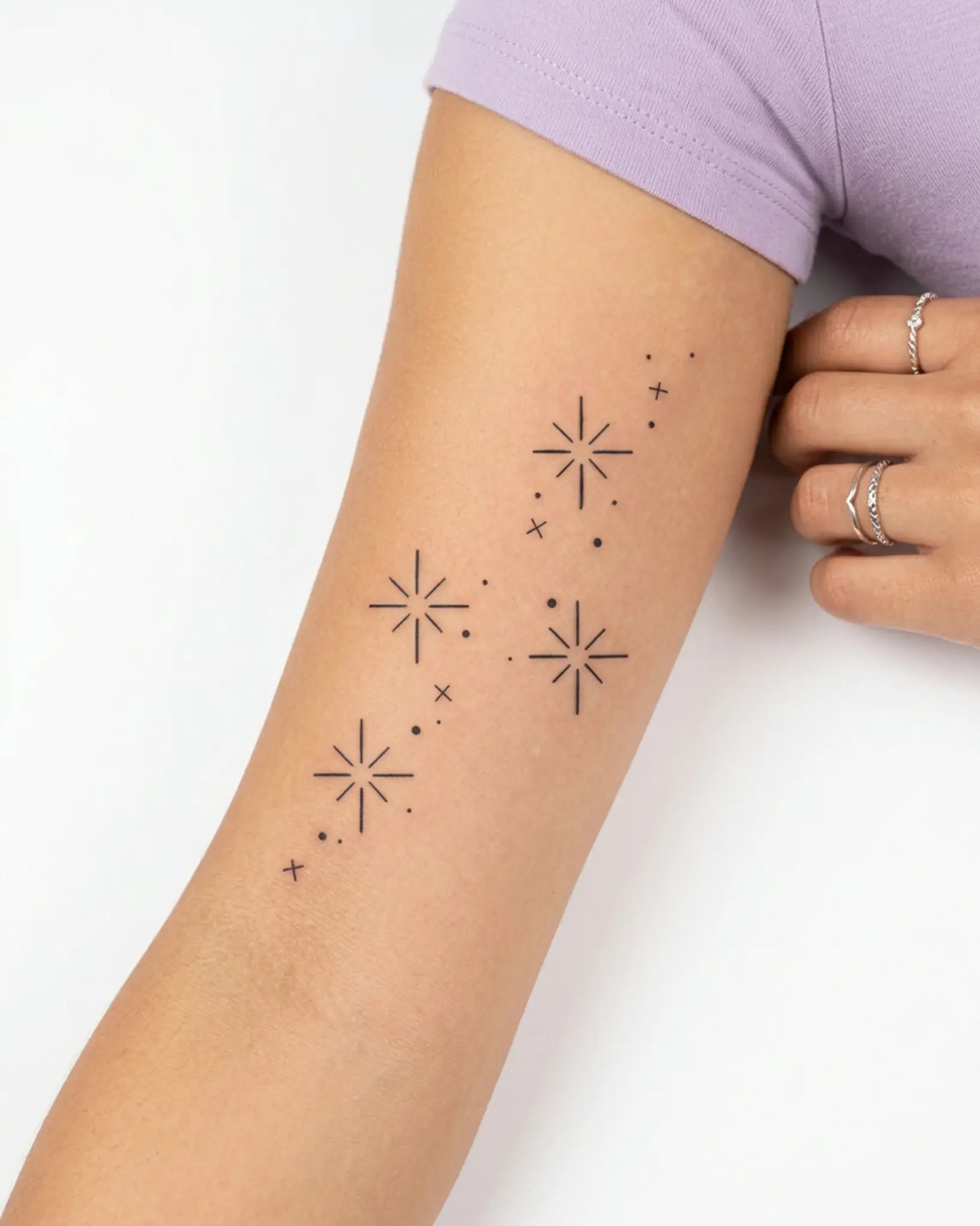 INKY Stardust semi-permanent tattoo applied on a woman – 2 x 4 in (6x10 cm) design, realistic ink look, lasts 10 days
