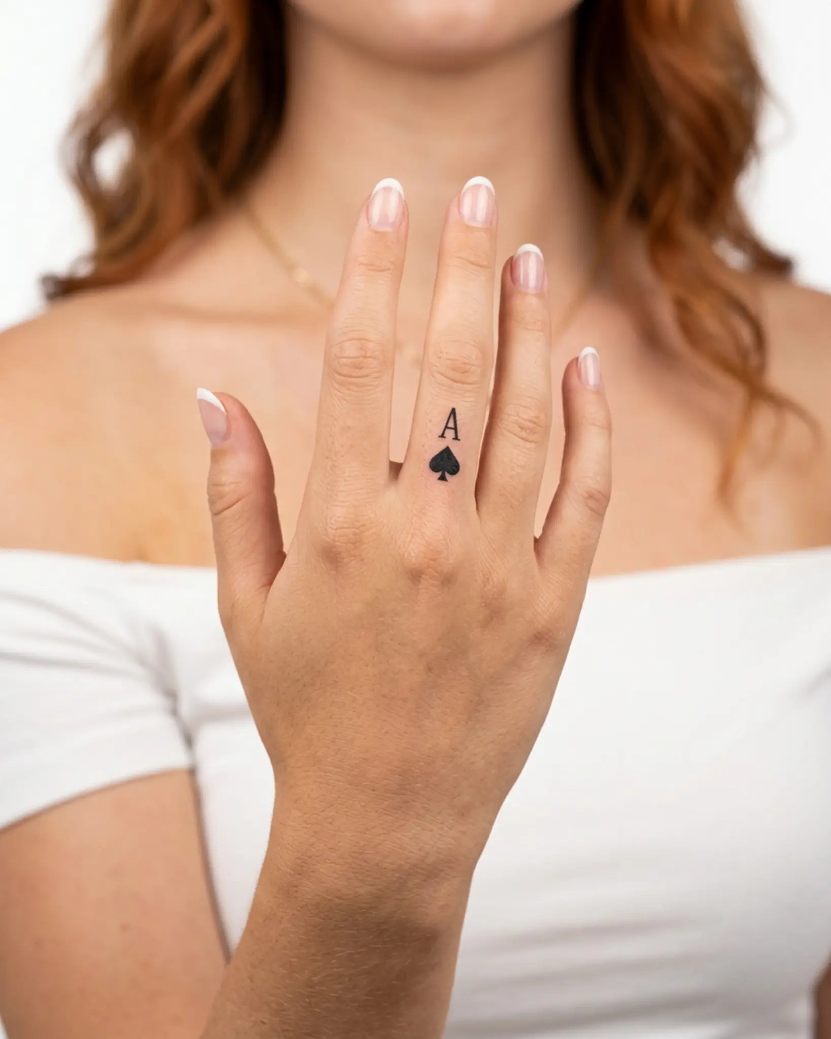 INKY Ace Spade 2 semi-permanent tattoo applied on a woman – 0.5 x 0.5 in (1x1 cm) design, realistic ink look, lasts 10 days