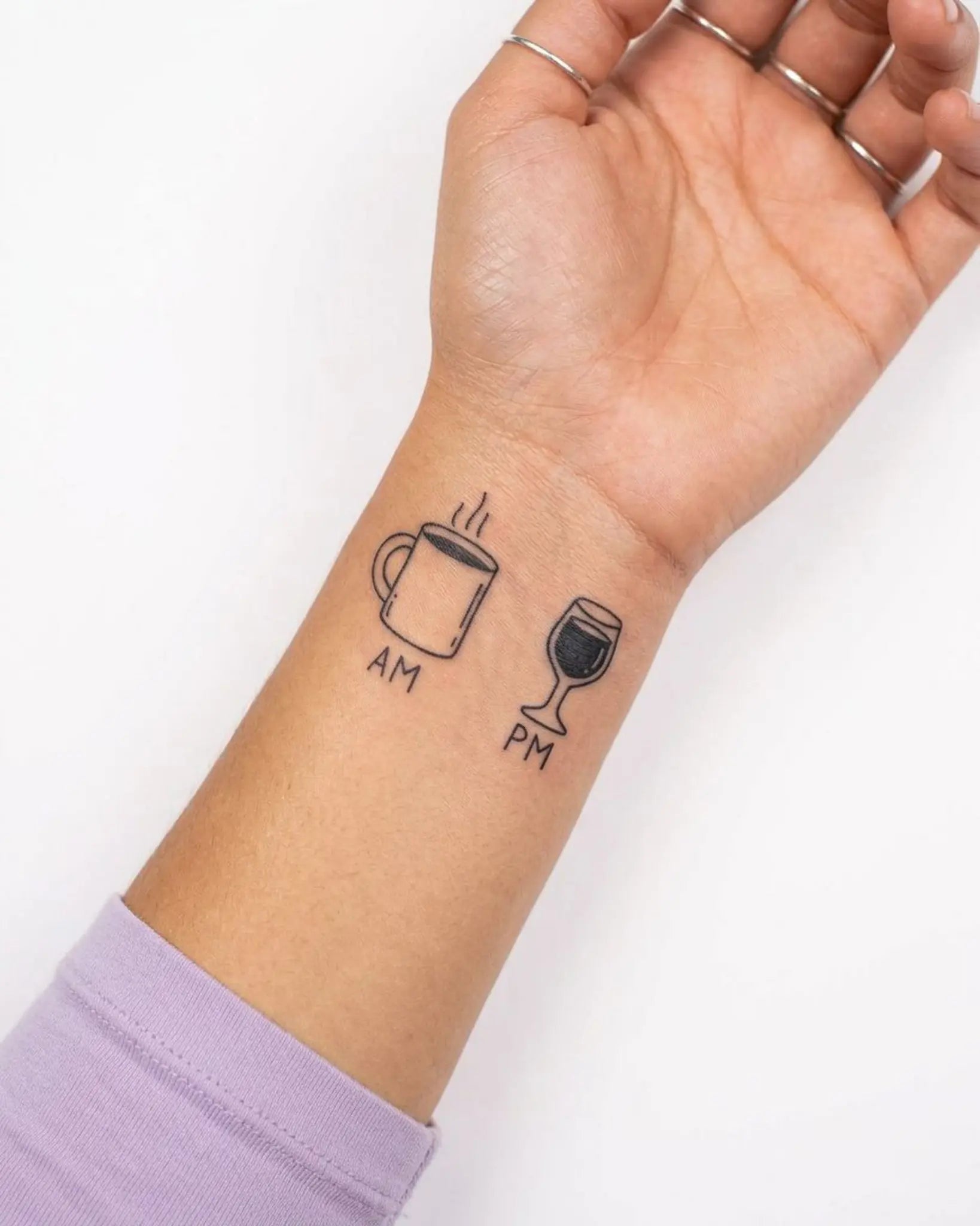 INKY AM PM semi-permanent tattoo applied on a woman – 2 x 2 in (4x4 cm) design, realistic ink look, lasts 10 days