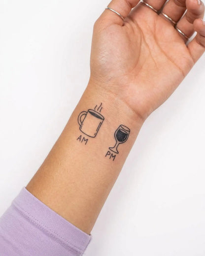 INKY AM PM semi-permanent tattoo applied on a woman – 2 x 2 in (4x4 cm) design, realistic ink look, lasts 10 days