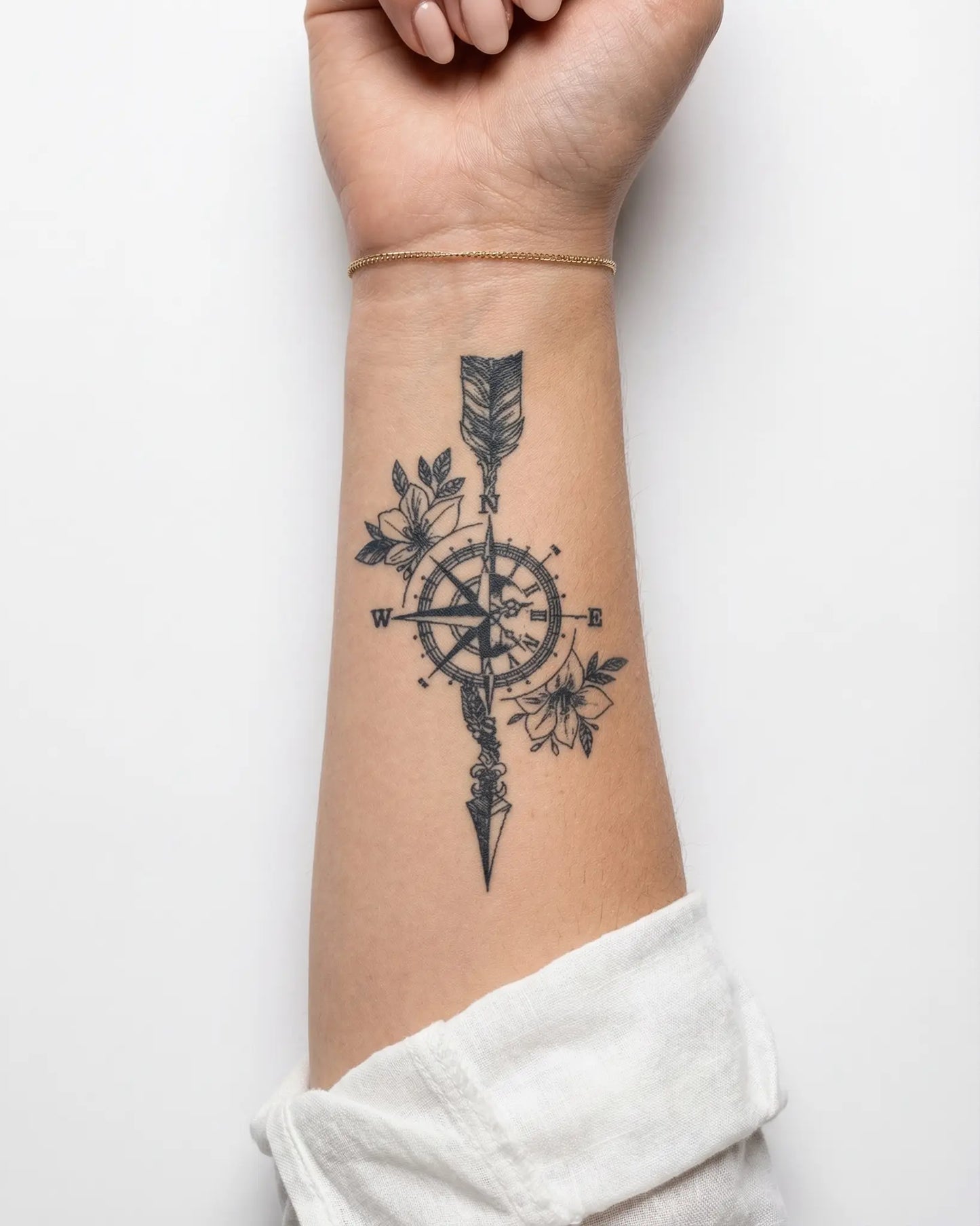 INKY Wanderlust 3 semi-permanent tattoo applied on a woman – 2 x 4 in (6x10 cm) design, realistic ink look, lasts 10 days