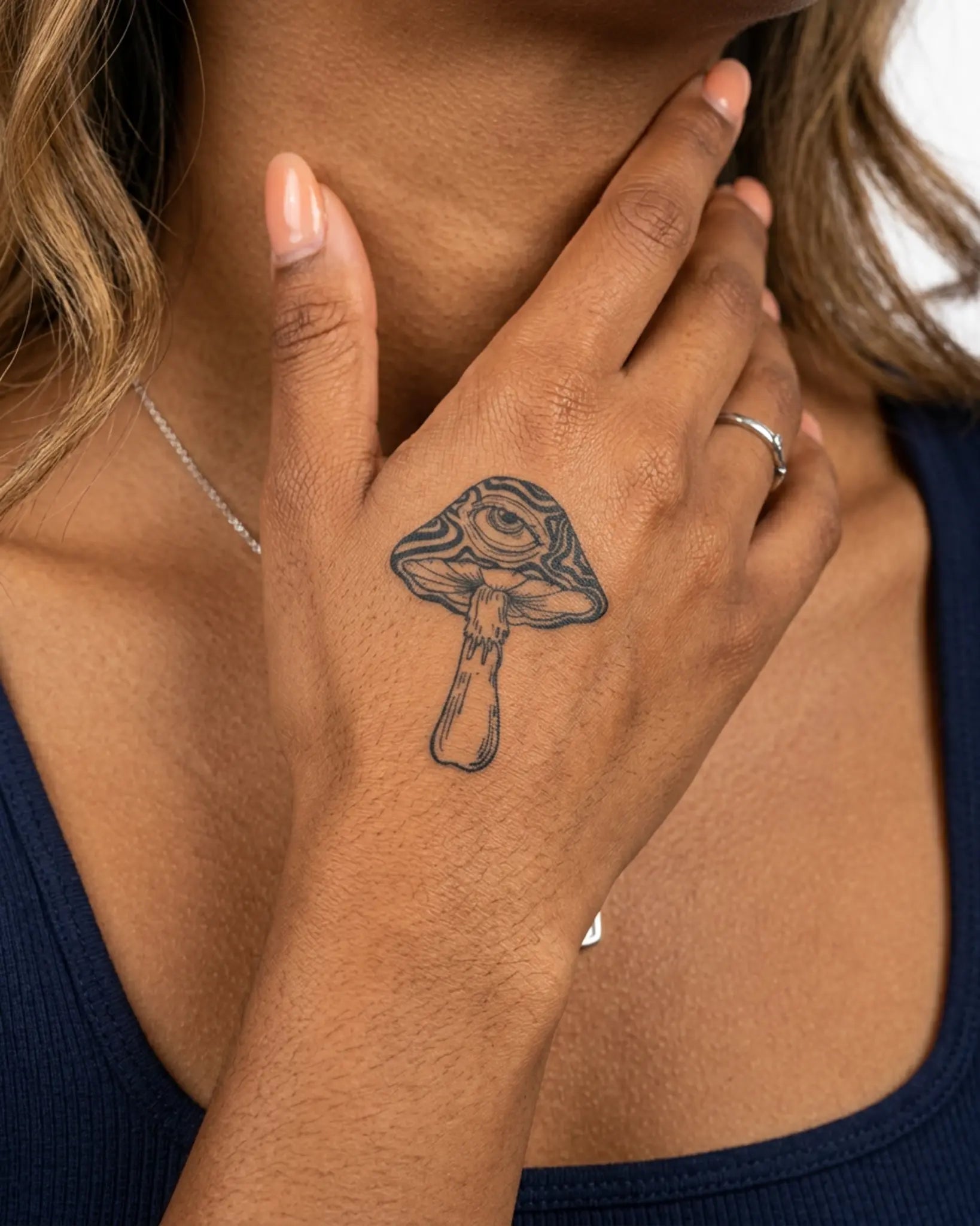 INKY Mystic Shroom 2 semi-permanent tattoo applied on a woman – 2 x 2 in (4x4 cm) design, realistic ink look, lasts 10 days