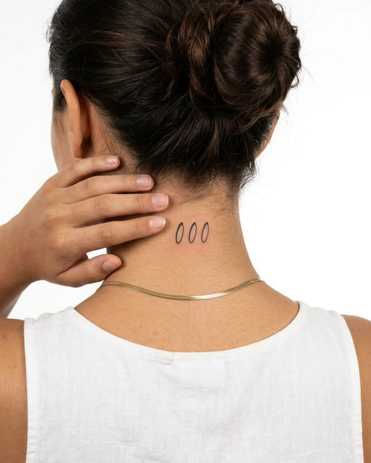 INKY Triple 0 semi-permanent tattoo applied on a woman – 2 x 2 in (4x4 cm) design, realistic ink look, lasts 10 days