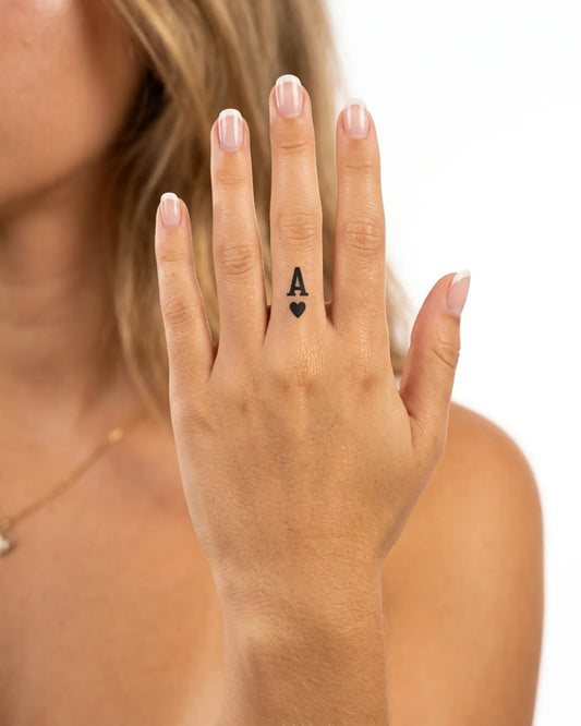 INKY Ace of Hearts semi-permanent tattoo applied on a woman – 0.5 x 0.5 in (1x1 cm) design, realistic ink look, lasts 10 days