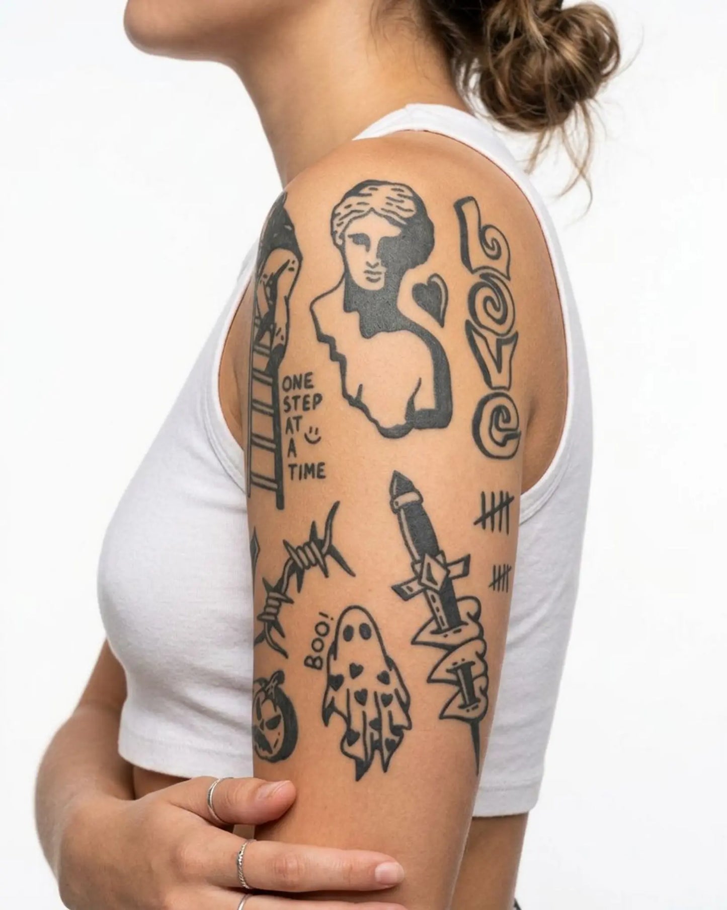 INKY Urban Doodles semi-permanent tattoo applied on a woman – 4 x 7 in (10x17 cm) design, realistic ink look, lasts 10 days