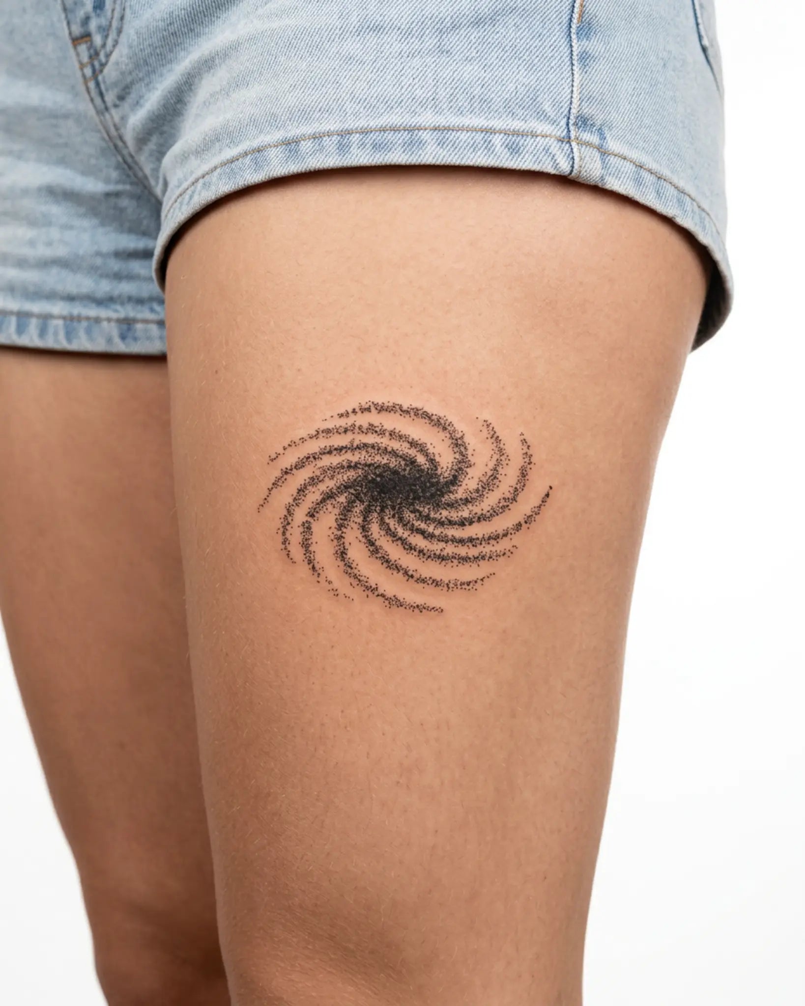 INKY Galaxy Swirl semi-permanent tattoo applied on a woman – 3 x 3 in (7x7 cm) design, realistic ink look, lasts 10 days