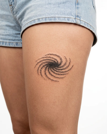 INKY Galaxy Swirl semi-permanent tattoo applied on a woman – 3 x 3 in (7x7 cm) design, realistic ink look, lasts 10 days