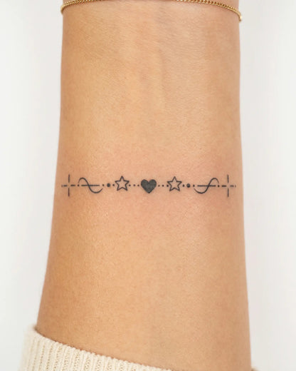 INKY Sweet Divider semi-permanent tattoo applied on a woman – 2 x 2 in (4x4 cm) design, realistic ink look, lasts 10 days