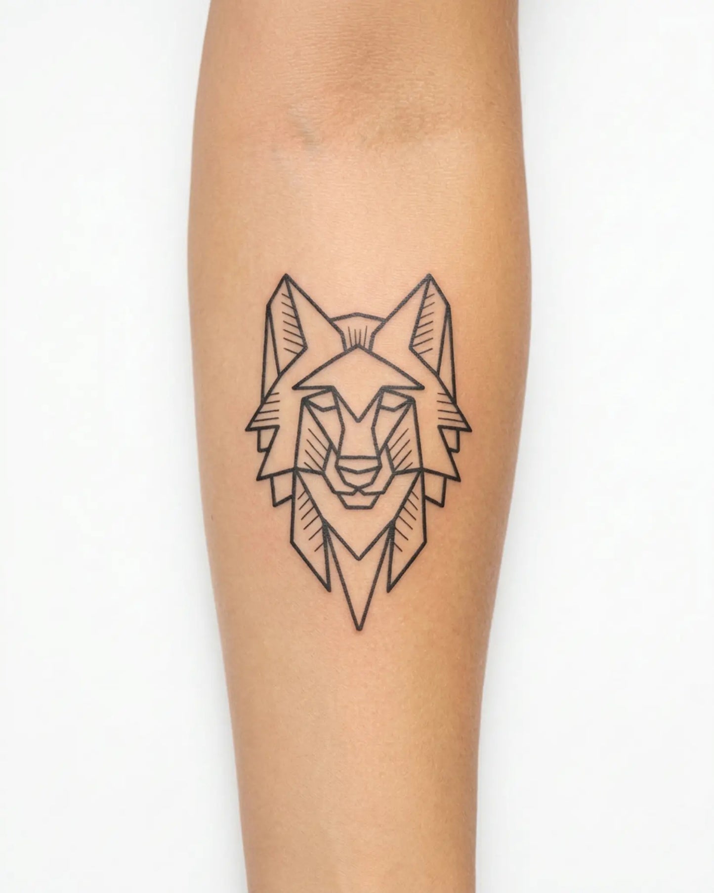 INKY Geo Wolf semi-permanent tattoo applied on a woman – 3 x 3 in (7x7 cm) design, realistic ink look, lasts 10 days
