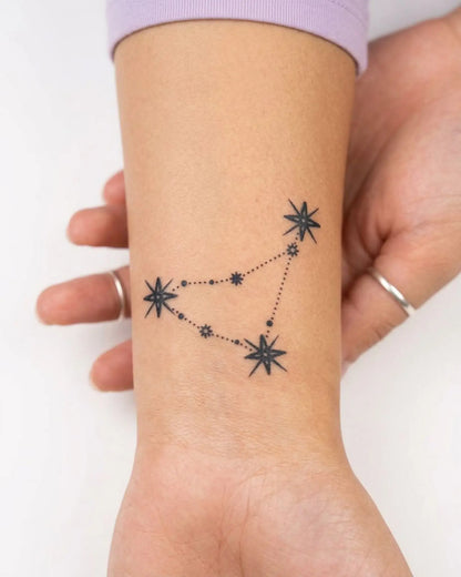 INKY Celestial Capricorn semi-permanent tattoo applied on a woman – 2 x 2 in (4x4 cm) design, realistic ink look, lasts 10 days