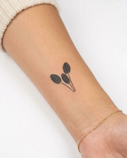 INKY Leafy Trio semi-permanent tattoo applied on a woman – 2 x 2 in (4x4 cm) design, realistic ink look, lasts 10 days