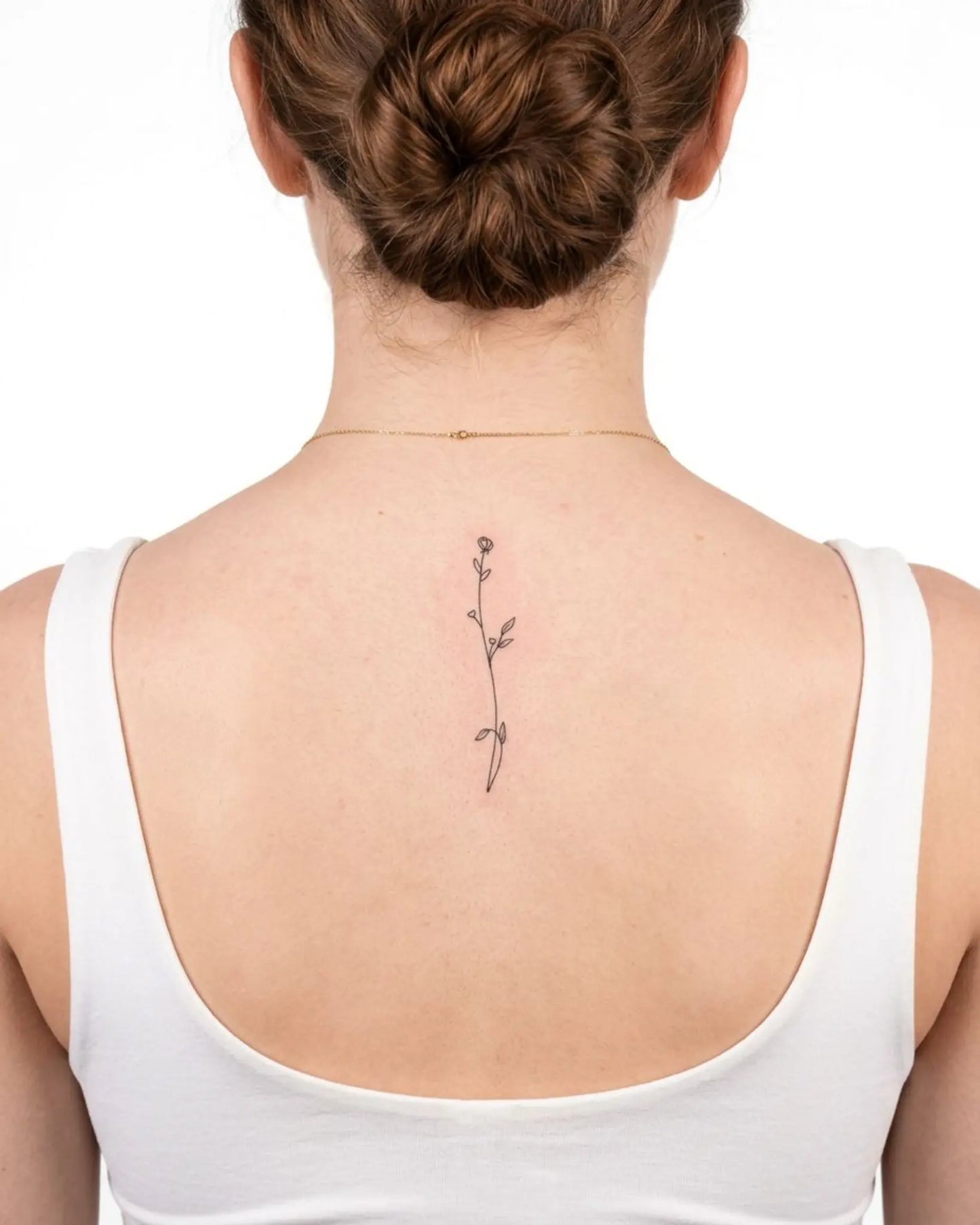 INKY Floral Stem semi-permanent tattoo applied on a woman – 2 x 4 in (6x10 cm) design, realistic ink look, lasts 10 days