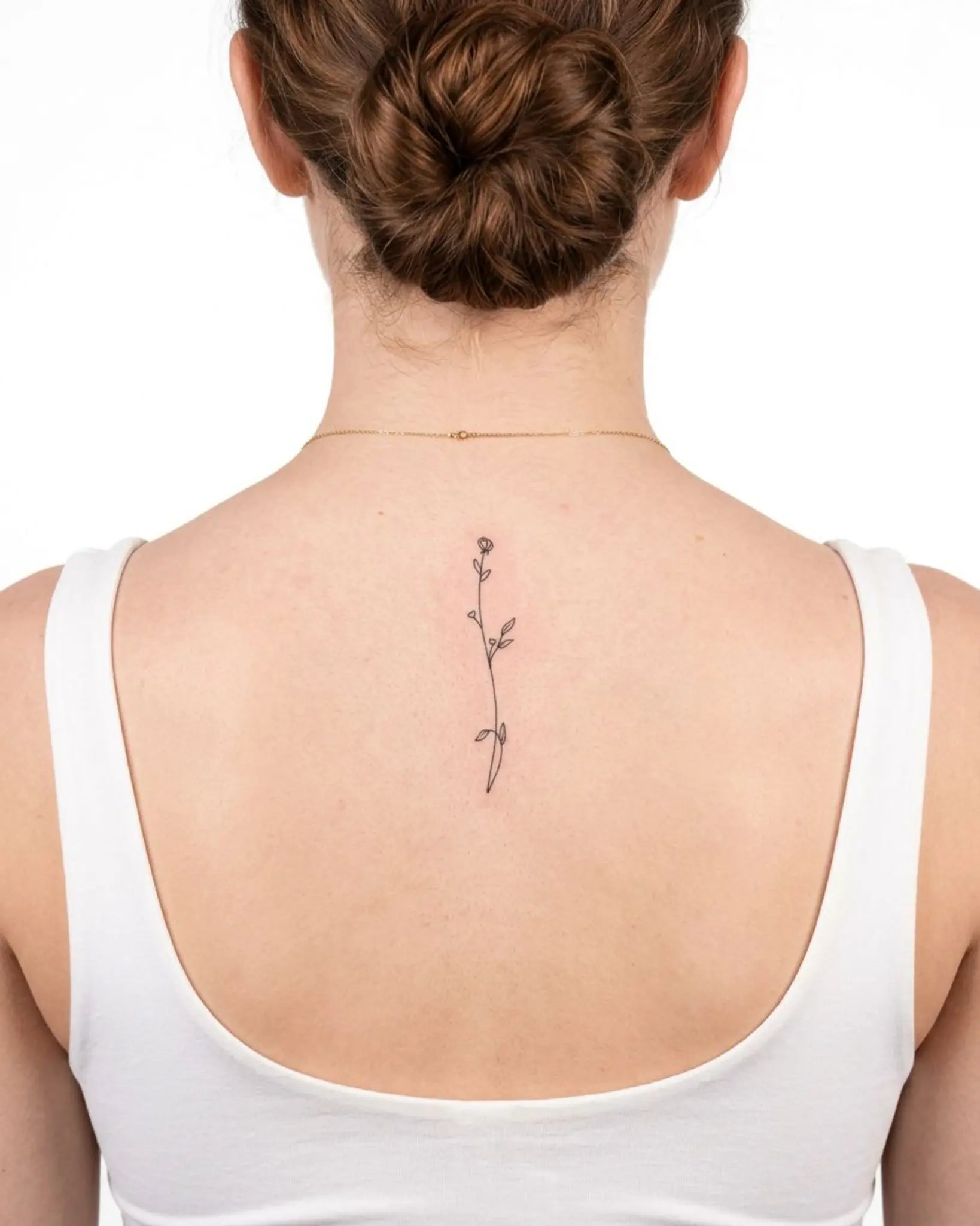 INKY Floral Stem semi-permanent tattoo applied on a woman – 2 x 4 in (6x10 cm) design, realistic ink look, lasts 10 days