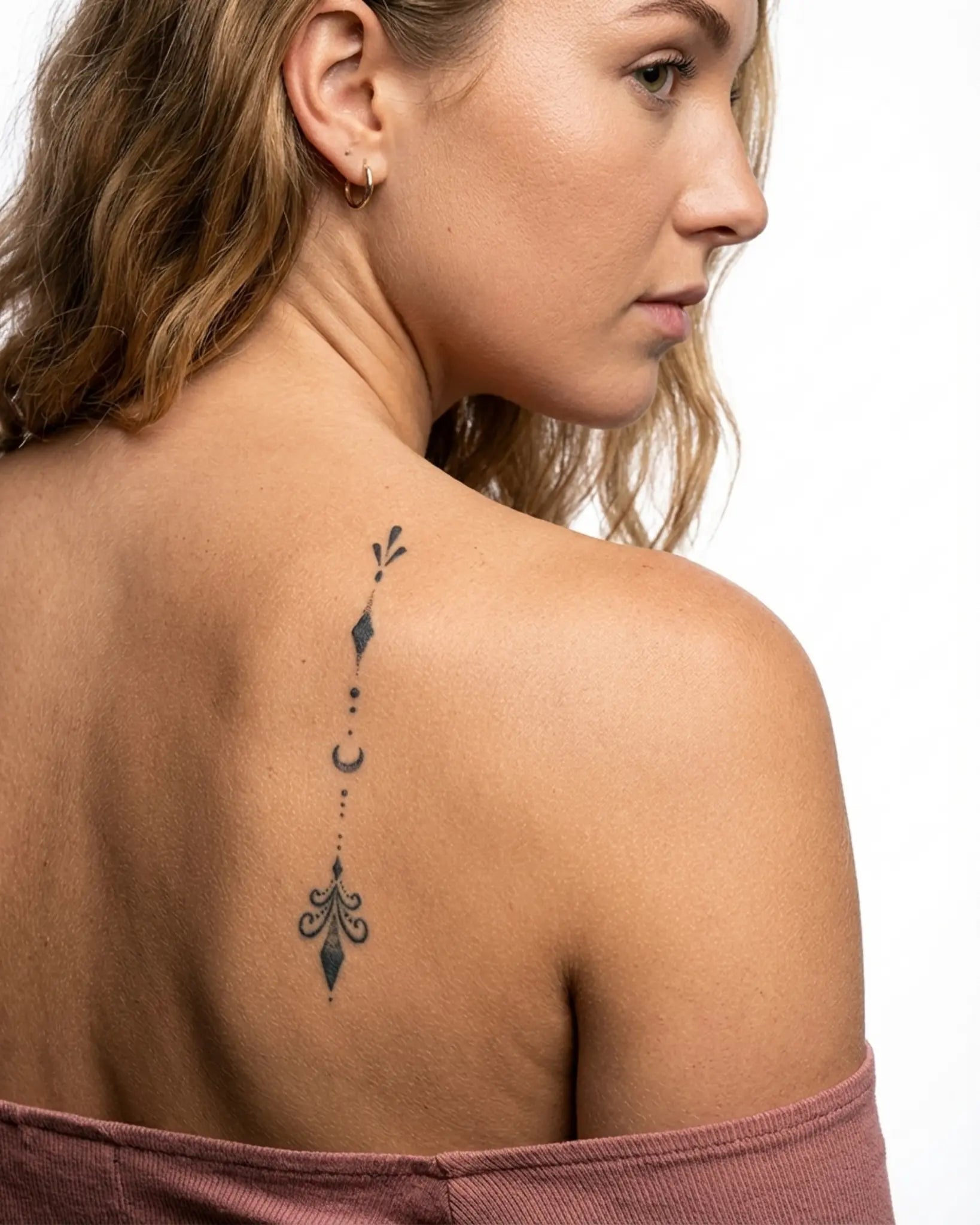 INKY Lunar Drop semi-permanent tattoo applied on a woman – 2 x 4 in (6x10 cm) design, realistic ink look, lasts 10 days