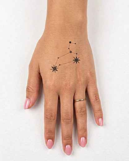 INKY Leo Star semi-permanent tattoo applied on a woman – 2 x 2 in (4x4 cm) design, realistic ink look, lasts 10 days