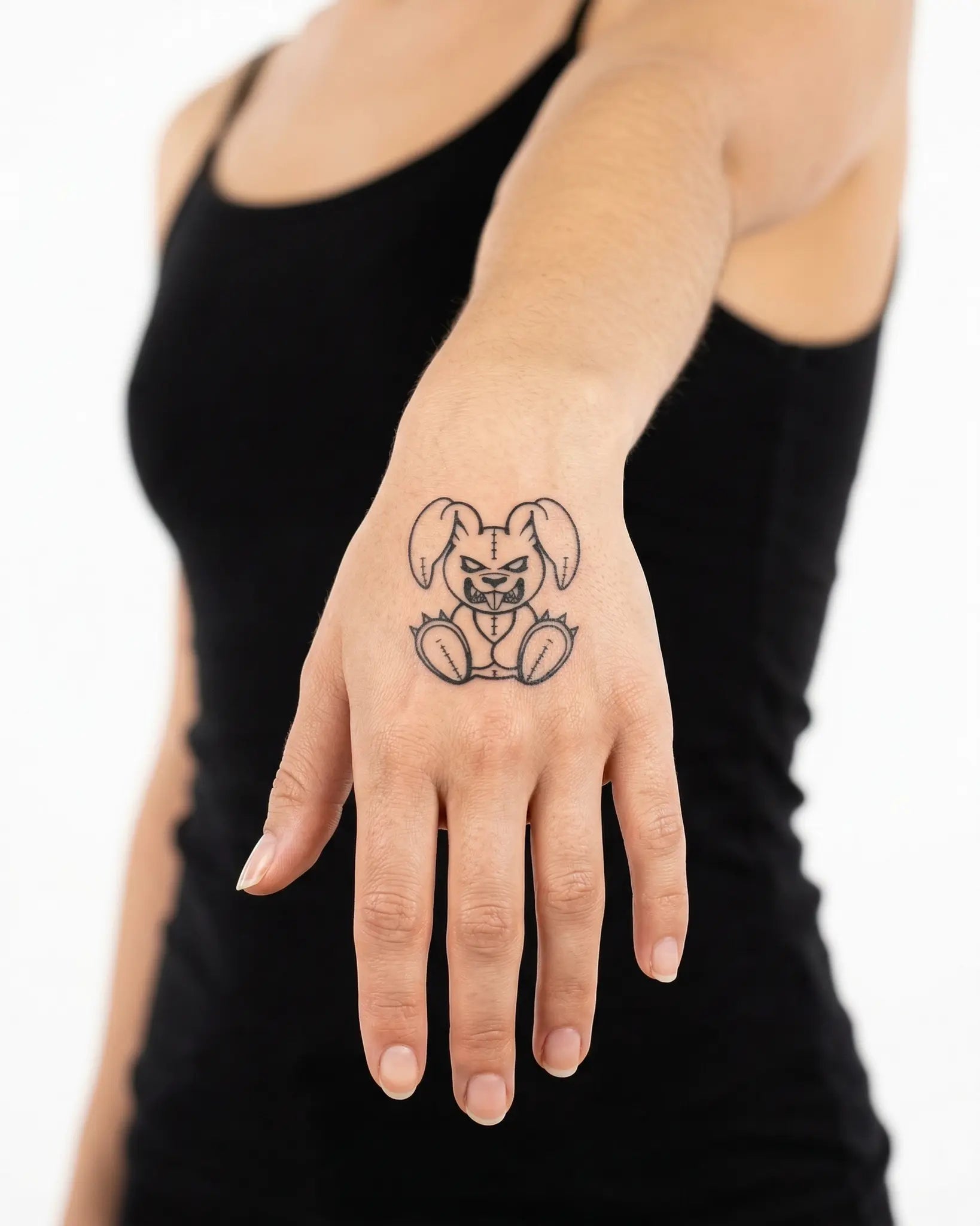 INKY Vicious Bun semi-permanent tattoo applied on a woman – 2 x 2 in (4x4 cm) design, realistic ink look, lasts 10 days