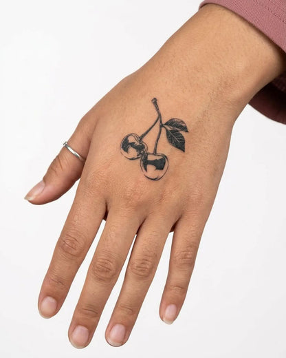 INKY Cherry Duo semi-permanent tattoo applied on a woman – 2 x 2 in (4x4 cm) design, realistic ink look, lasts 10 days