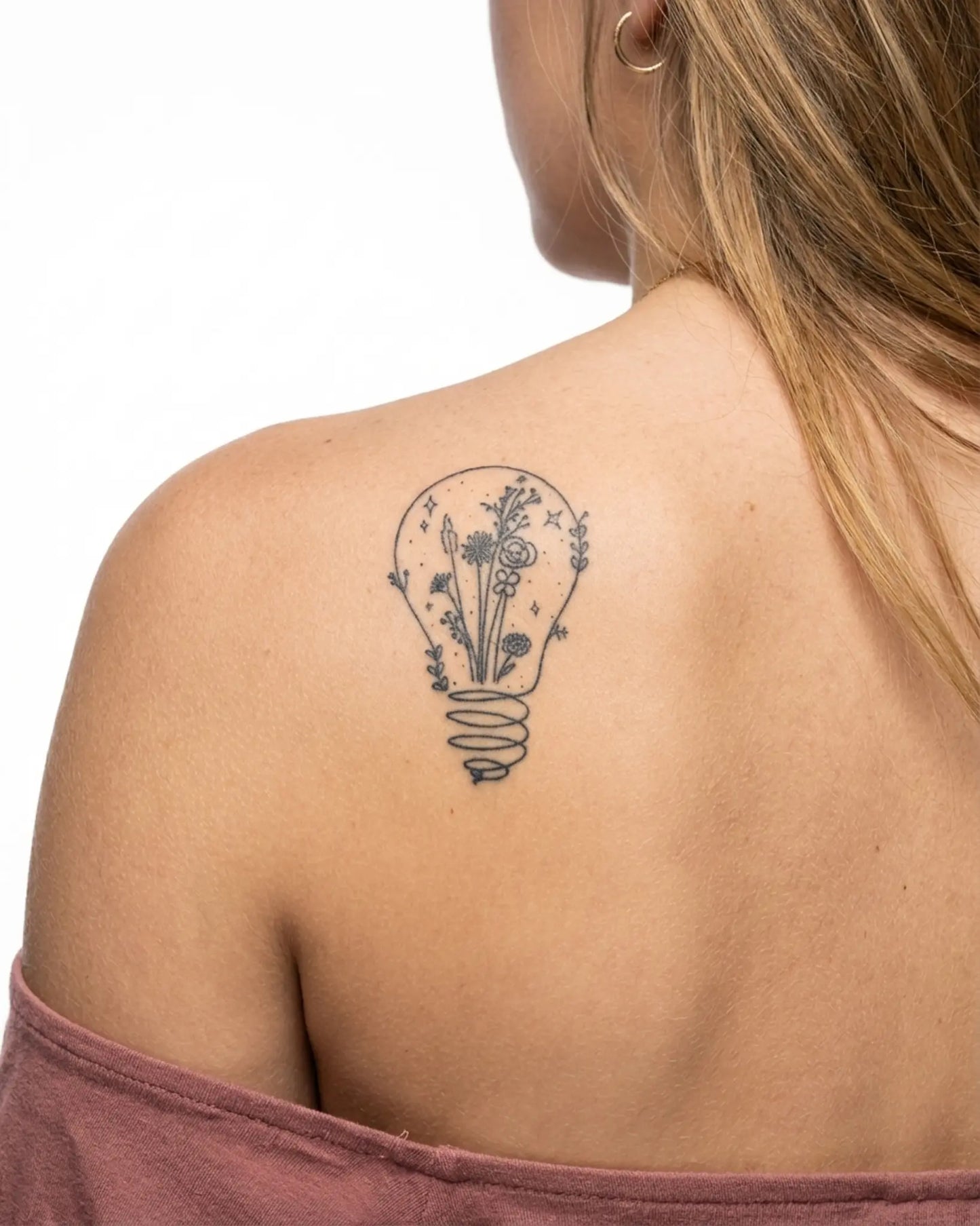INKY Light Bloom 2 2 semi-permanent tattoo applied on a woman – 2 x 4 in (6x10 cm) design, realistic ink look, lasts 10 days