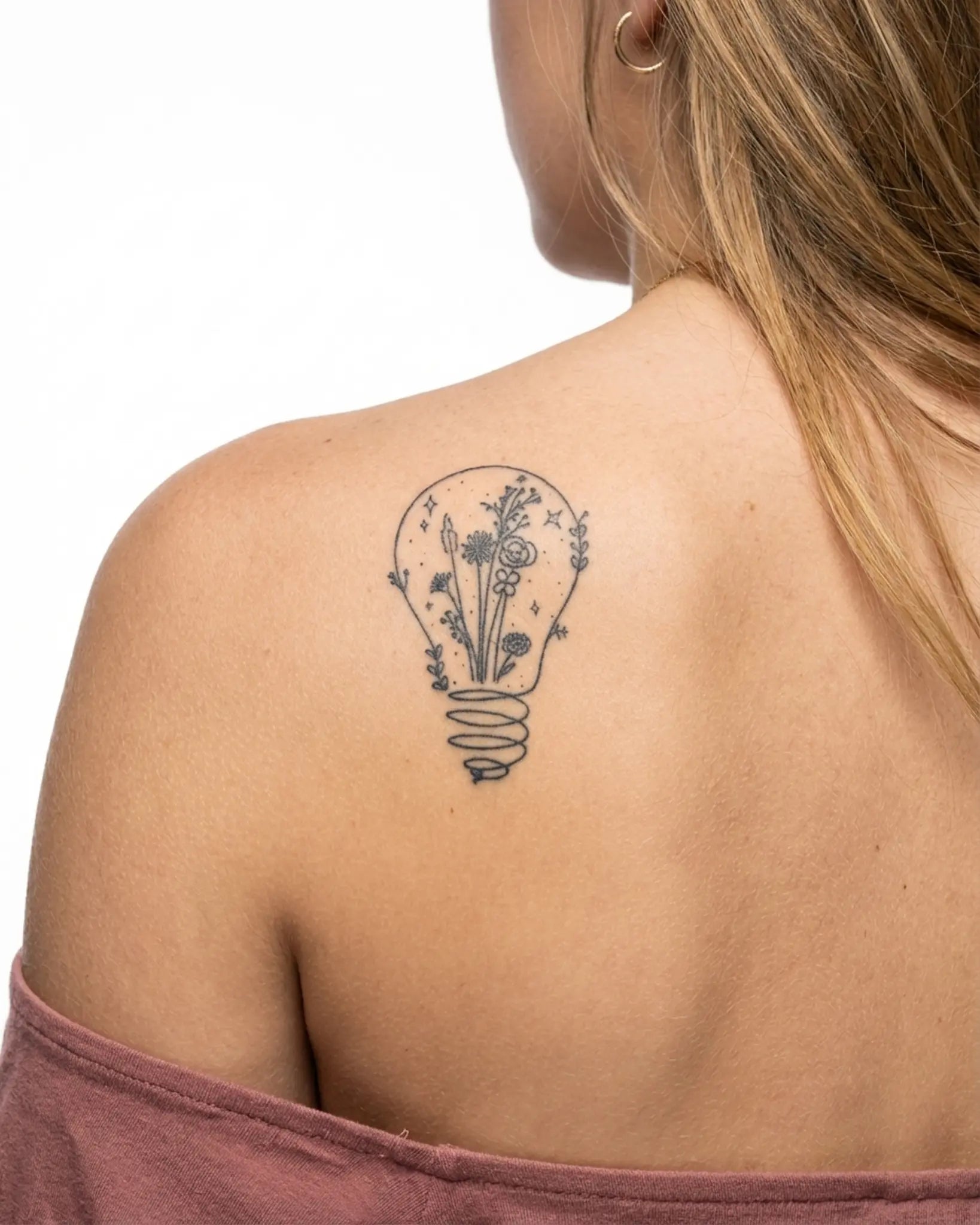 INKY Light Bloom 2 2 semi-permanent tattoo applied on a woman – 2 x 4 in (6x10 cm) design, realistic ink look, lasts 10 days