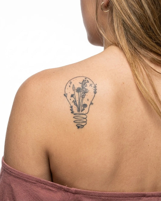 INKY Light Bloom 2 2 semi-permanent tattoo applied on a woman – 2 x 4 in (6x10 cm) design, realistic ink look, lasts 10 days