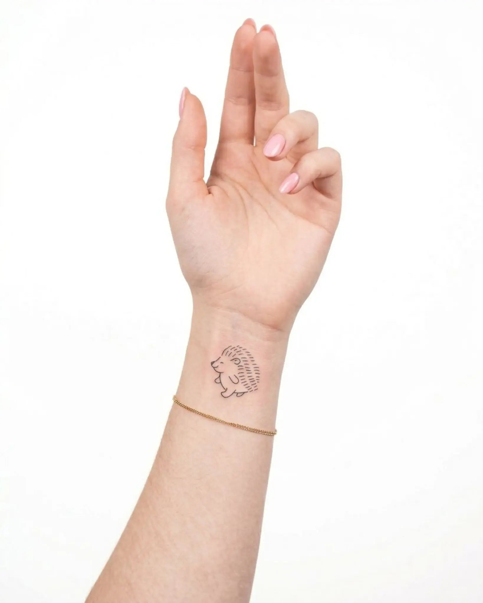 INKY Happy Hedgy semi-permanent tattoo applied on a woman – 2 x 2 in (4x4 cm) design, realistic ink look, lasts 10 days