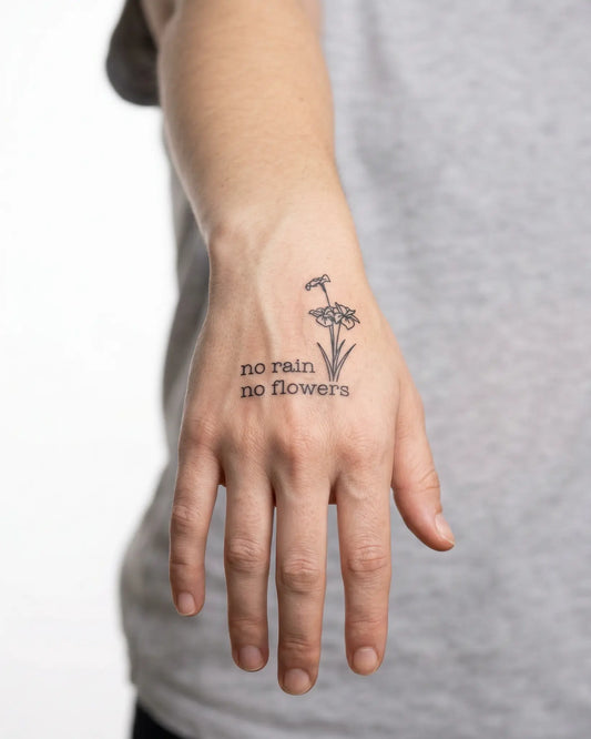 INKY No Rain Flow 2 semi-permanent tattoo applied on a woman – 2 x 2 in (4x4 cm) design, realistic ink look, lasts 10 days
