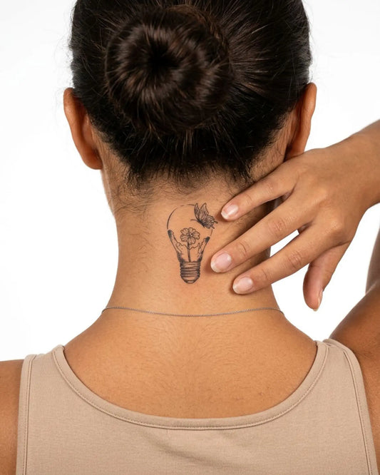 INKY Light Bloom semi-permanent tattoo applied on a woman – 2 x 2 in (4x4 cm) design, realistic ink look, lasts 10 days