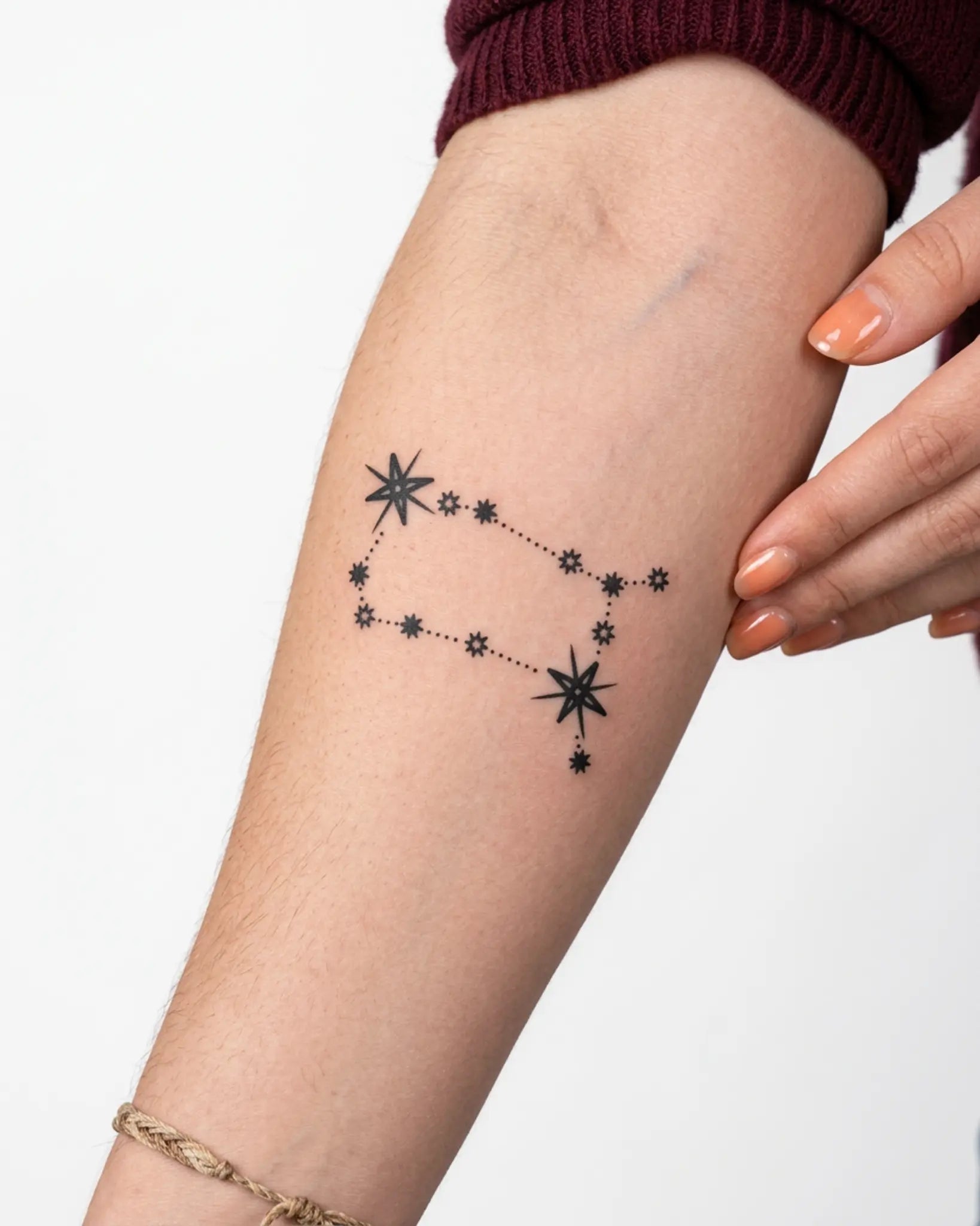 INKY Starry Path Gemini semi-permanent tattoo applied on a woman – 3 x 3 in (7x7 cm) design, realistic ink look, lasts 10 days