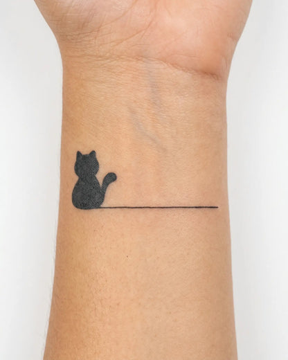 INKY Minimal Cat semi-permanent tattoo applied on a woman – 2 x 2 in (4x4 cm) design, realistic ink look, lasts 10 days