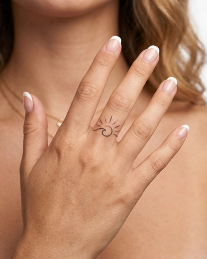 INKY Sun Wave semi-permanent tattoo applied on a woman – 0.5 x 0.5 in (1x1 cm) design, realistic ink look, lasts 10 days