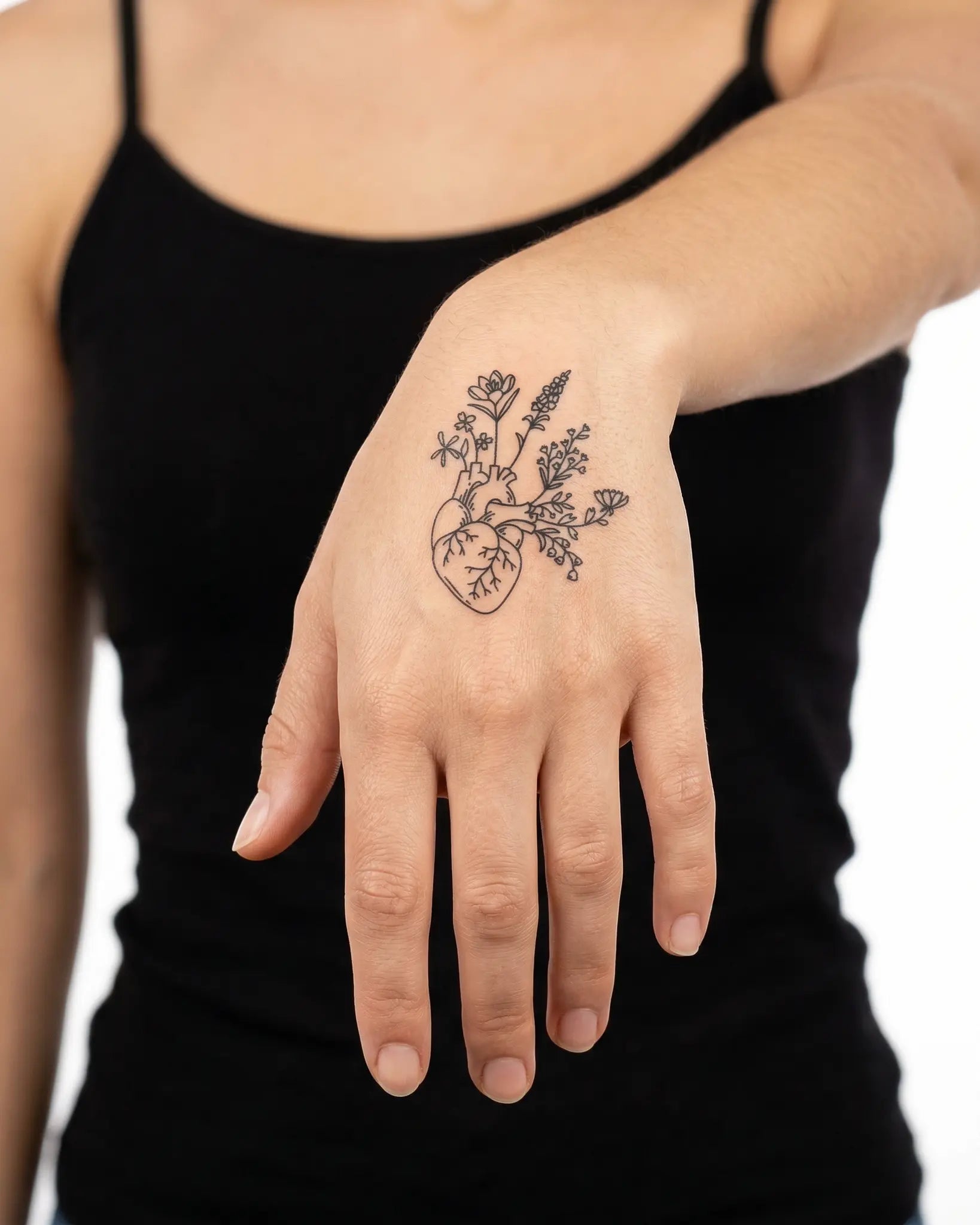 INKY Floral Heart semi-permanent tattoo applied on a woman – 2 x 2 in (4x4 cm) design, realistic ink look, lasts 10 days