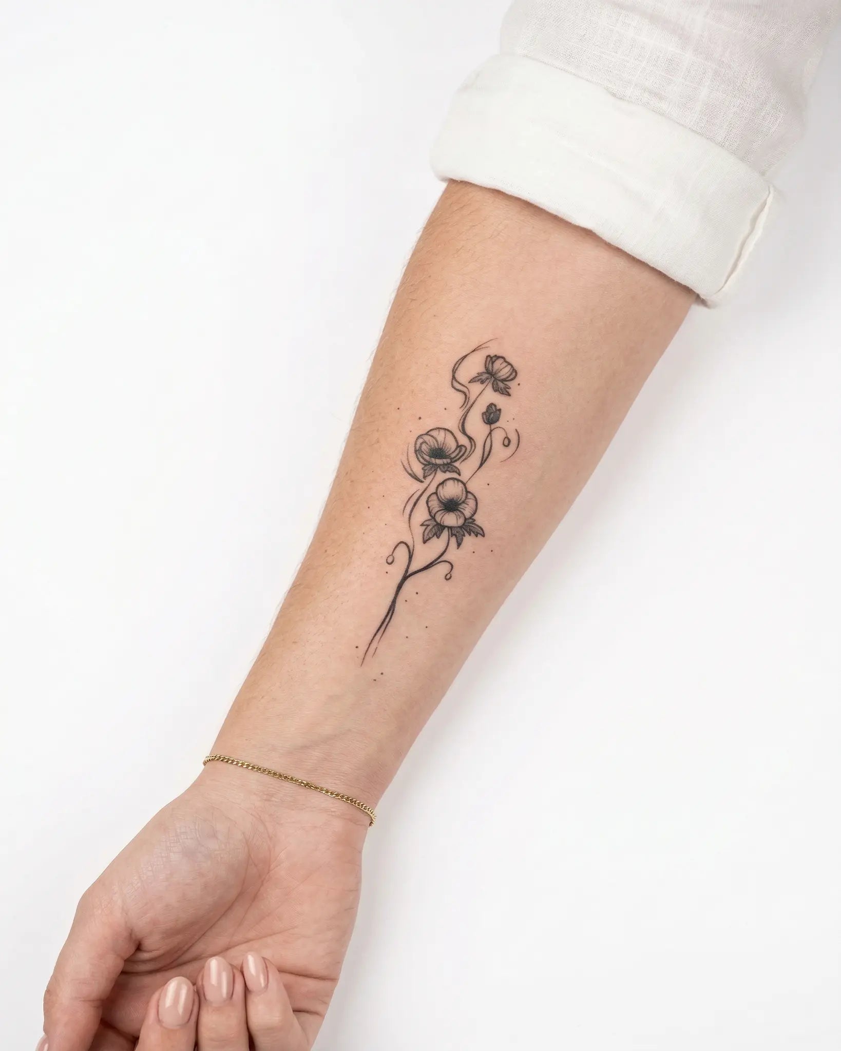 INKY Floral Swirl 3 semi-permanent tattoo applied on a woman – 2 x 4 in (6x10 cm) design, realistic ink look, lasts 10 days
