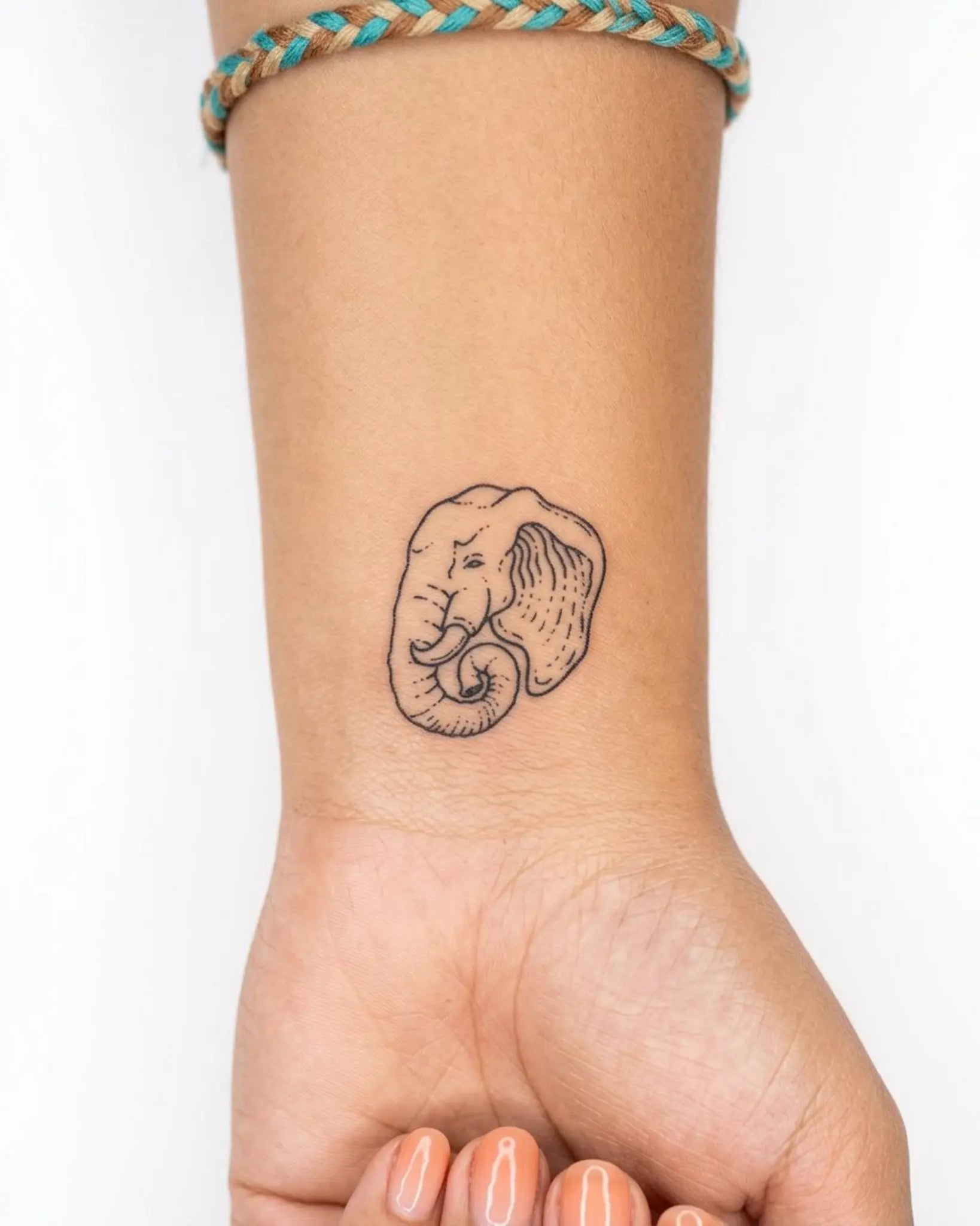 INKY Wild Ele semi-permanent tattoo applied on a woman – 2 x 2 in (4x4 cm) design, realistic ink look, lasts 10 days