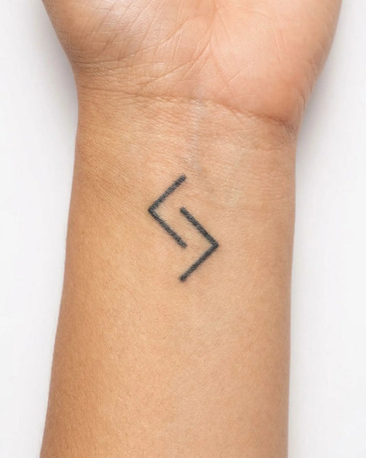 INKY Abstract S semi-permanent tattoo applied on a woman – 0.5 x 0.5 in (1x1 cm) design, realistic ink look, lasts 10 days