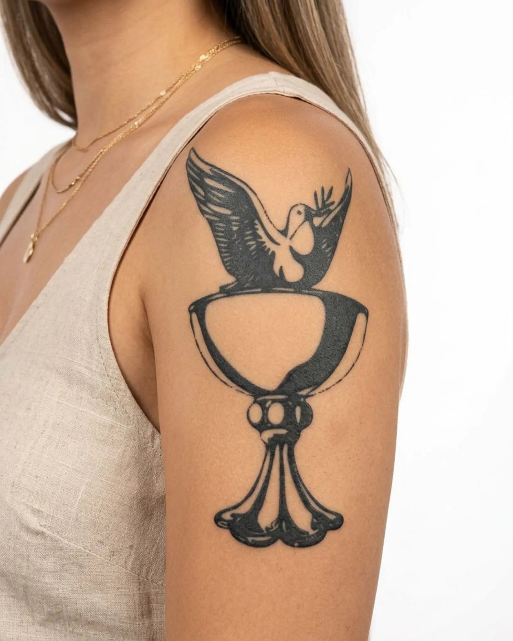 INKY Peace Chalice 2 semi-permanent tattoo applied on a woman – 4 x 7 in (10x17 cm) design, realistic ink look, lasts 10 days