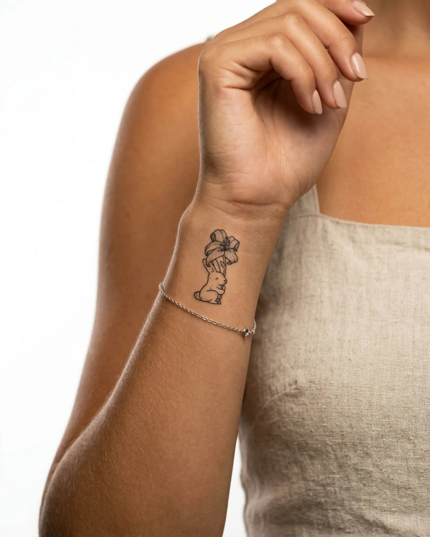 INKY Bunny Lily 2 semi-permanent tattoo applied on a woman – 2 x 2 in (4x4 cm) design, realistic ink look, lasts 10 days