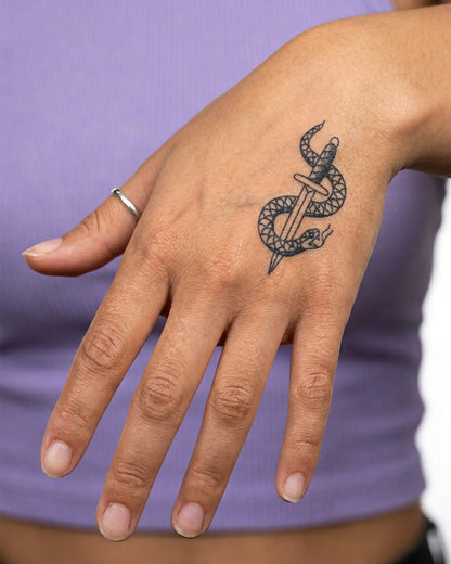 INKY Snake Dagger semi-permanent tattoo applied on a woman – 2 x 2 in (4x4 cm) design, realistic ink look, lasts 10 days