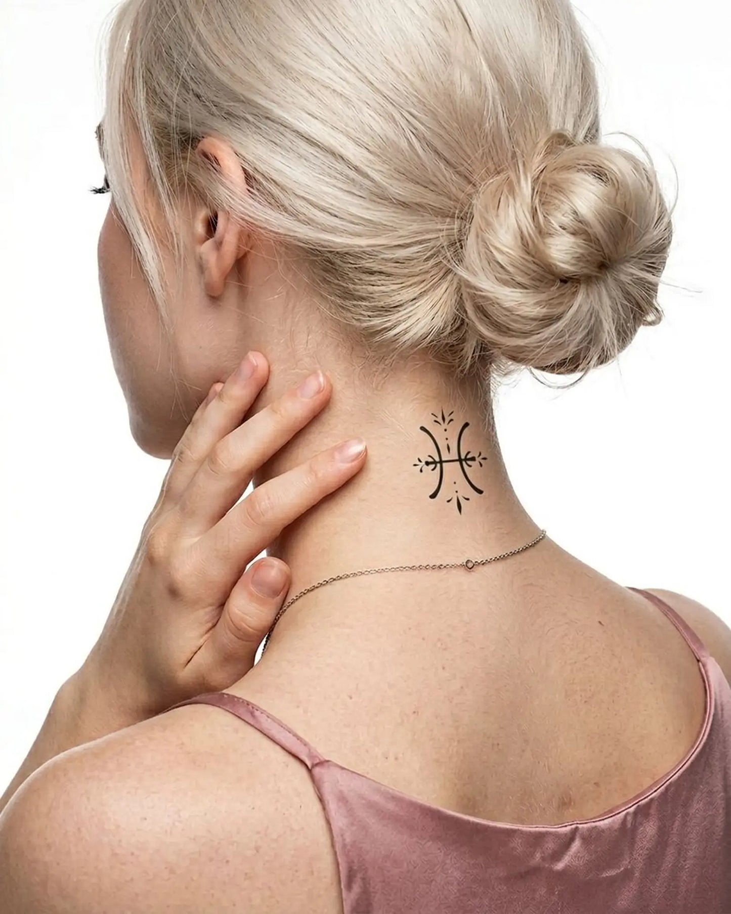 INKY Pisces Symbol semi-permanent tattoo applied on a woman – 2 x 2 in (4x4 cm) design, realistic ink look, lasts 10 days