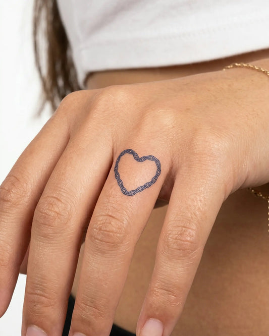 INKY Chain Heart semi-permanent tattoo applied on a woman – 0.5 x 0.5 in (1x1 cm) design, realistic ink look, lasts 10 days