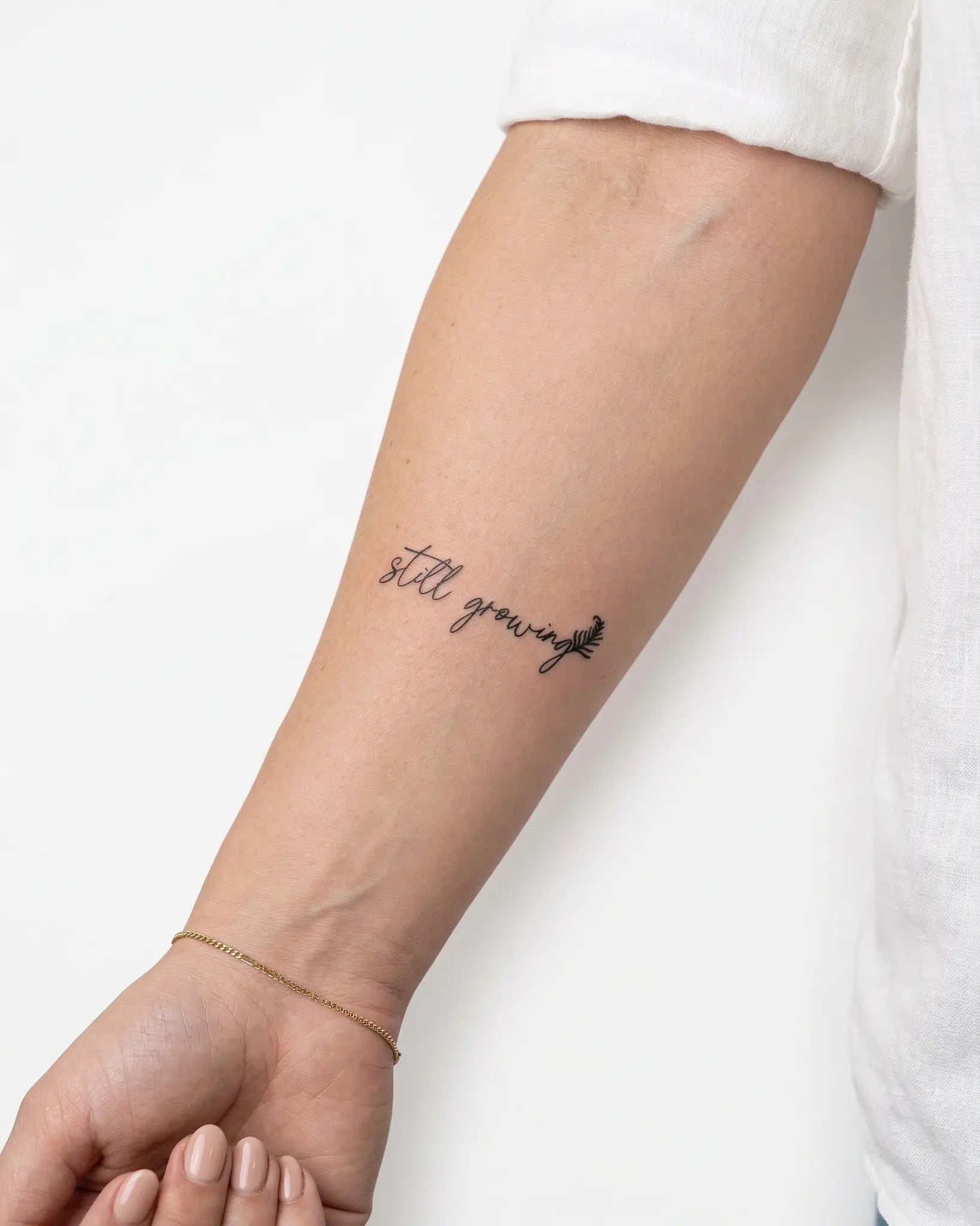 INKY Still Growing 3 semi-permanent tattoo applied on a woman – 2 x 2 in (4x4 cm) design, realistic ink look, lasts 10 days
