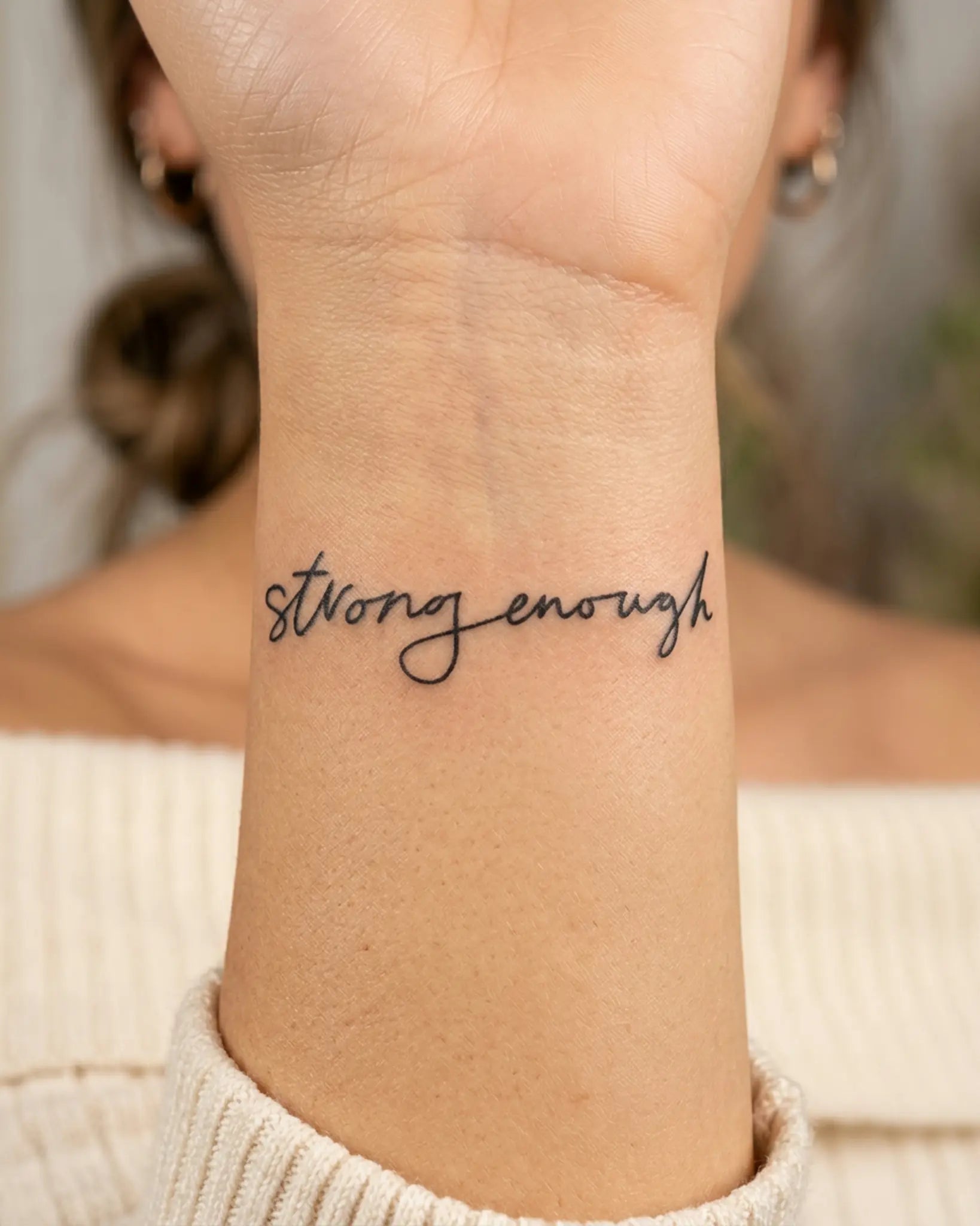 INKY StrongEnough semi-permanent tattoo applied on a woman – 2 x 2 in (4x4 cm) design, realistic ink look, lasts 10 days